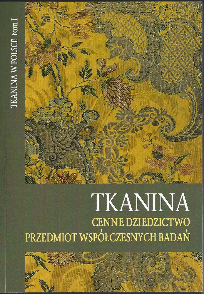 Żakardowy motyw kwiatowy w kolorach zgaszonej zieleni i żółci, rozdzielony niesymetrycznie pasem gładkiej zieleni, z widniejącym na nim białym napisem TKANINA. CENNE DZIEDZICTWO. PRZEDMIOT WSPÓŁCZESNYCH BADAŃ. W lewym górnym rogu pionowy, znacznie mniejszy napis: TKANINA W POLSCE, tom 1